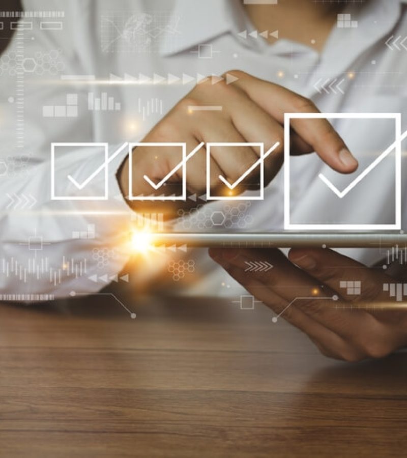 Businessman-Working-With-Tablet-Checking-Mark-Up-On-The-Check-Boxes